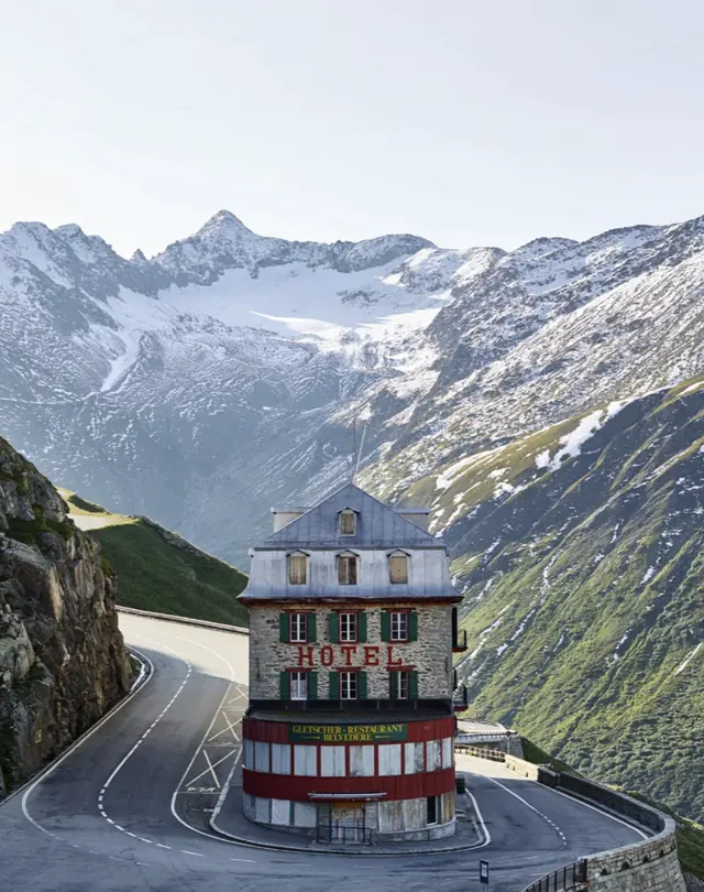 The old Hotel Belvedere on the Furka pass road with the Rhône glacier behind it